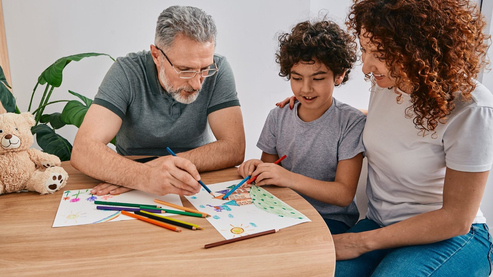 A teacher painting with young students